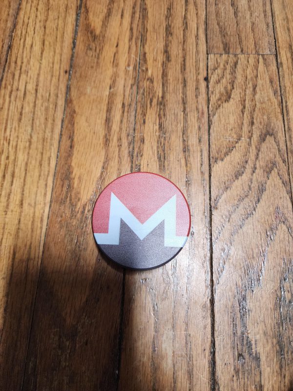 top of a two-piece Monero themed grinder